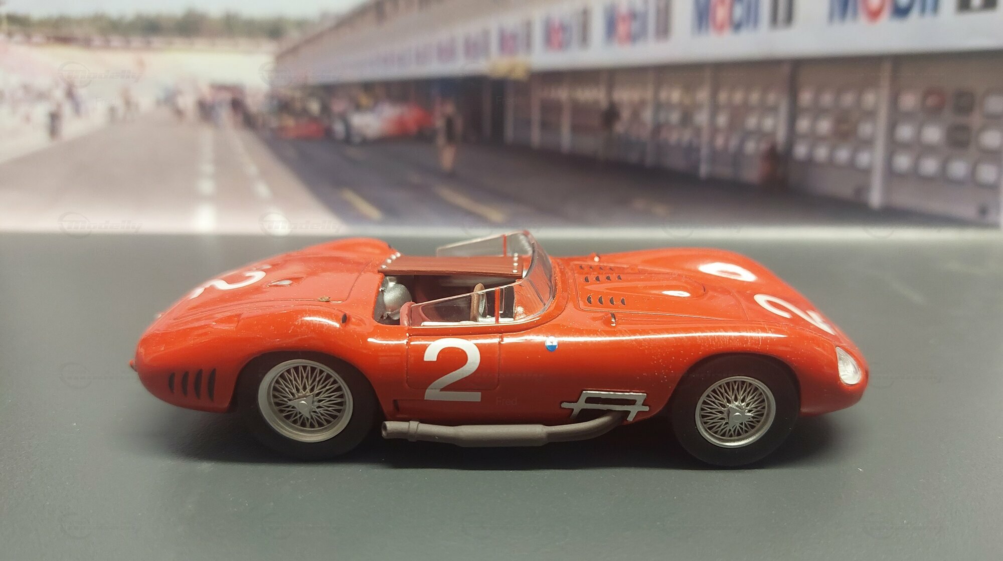 Diecast Maserati 450 S modelcar, LEO Models 1:43 in red owned by 'Fred'